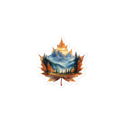 Maple leaf design with a mountain landscape inside on a white background