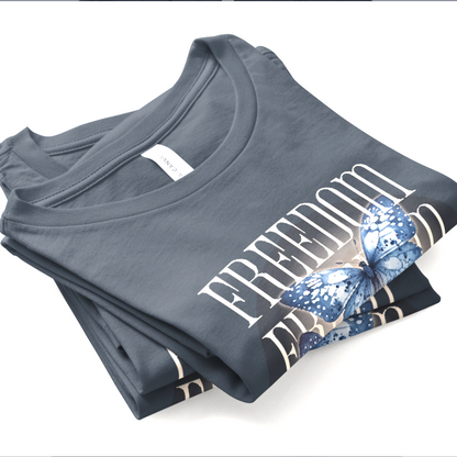 Folded gray t-shirt with a butterflies design on a white background