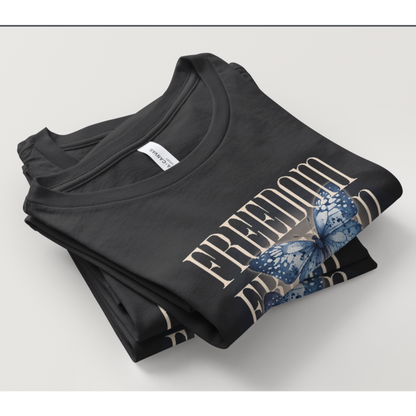 Folded black t-shirt with butterflies design on a light gray background