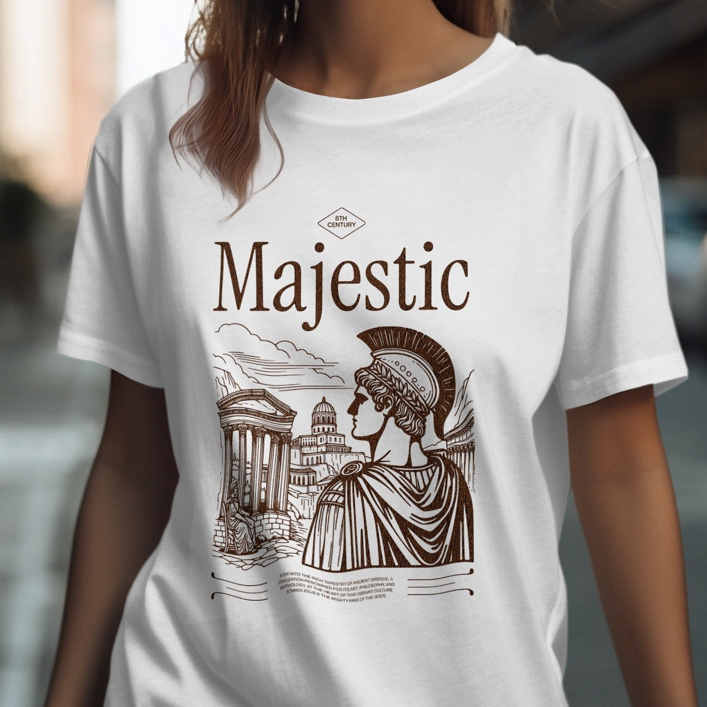 White t-shirt with 'Majestic' design featuring a classical illustration of a woman in a helmet and ancient architecture.