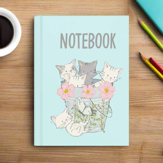 Notebook with cat and flower design on a light blue background